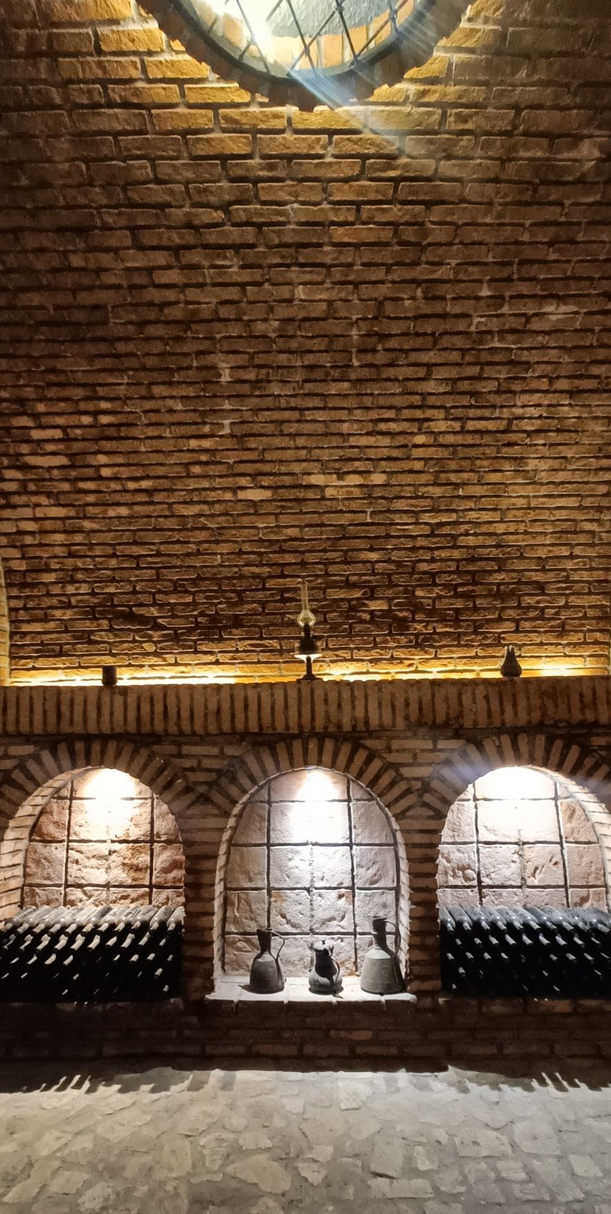 Winery tunnel with wine bottles